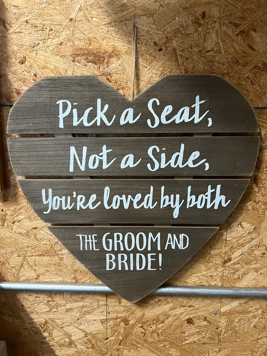 Pick a seat sign